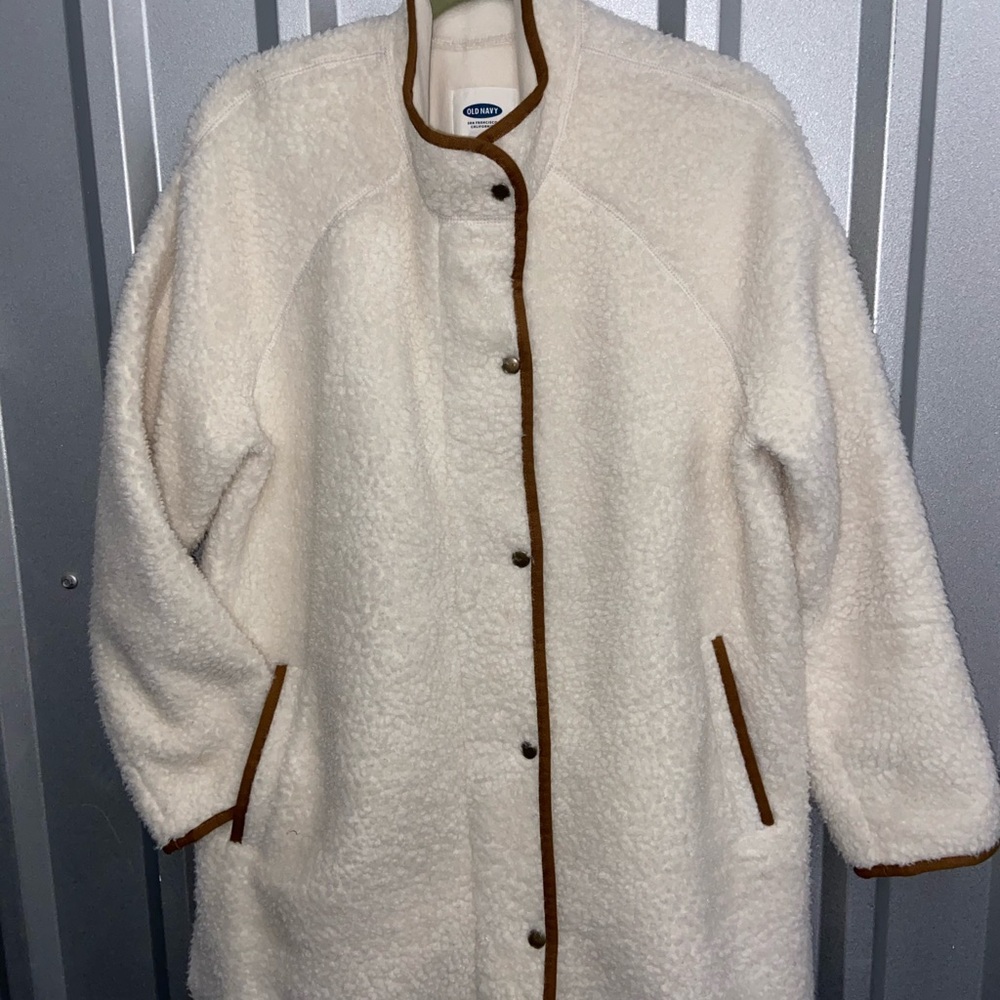 Beige with brown trim coat